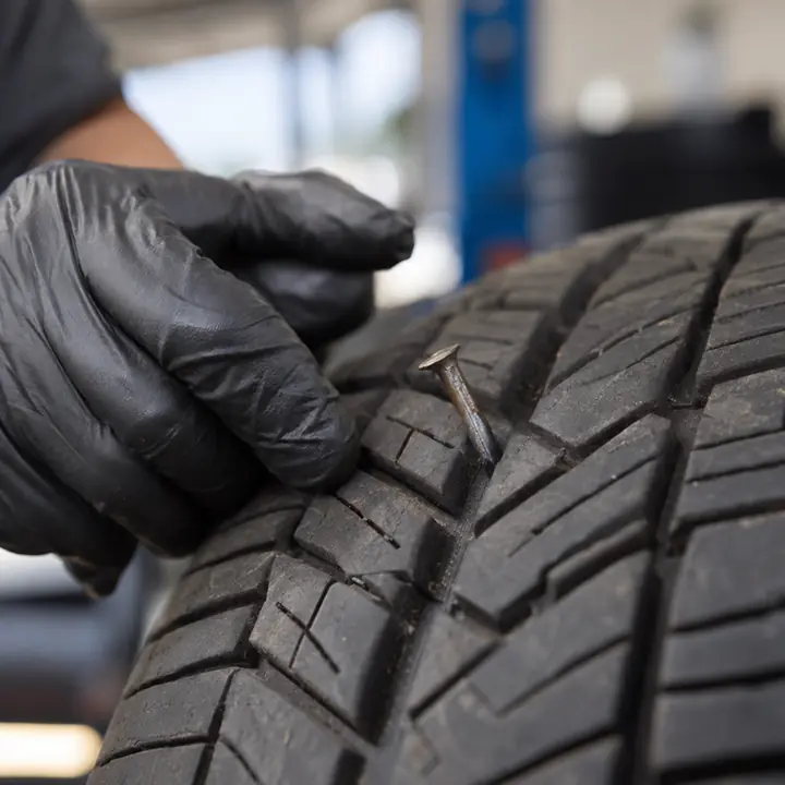 A nail lodged in a tire’s tread